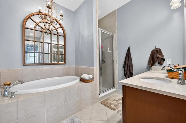a bathroom with a sink vanity and a mirror