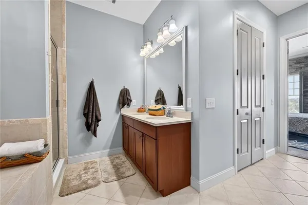 a bathroom with a tub and a window