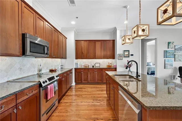 a large kitchen with lots of counter space and living room view