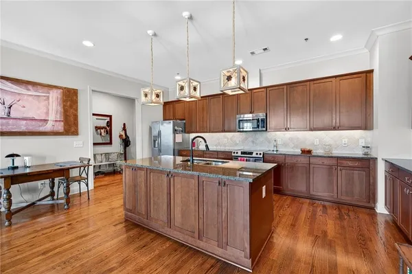 a kitchen counter top space a sink and cabinets