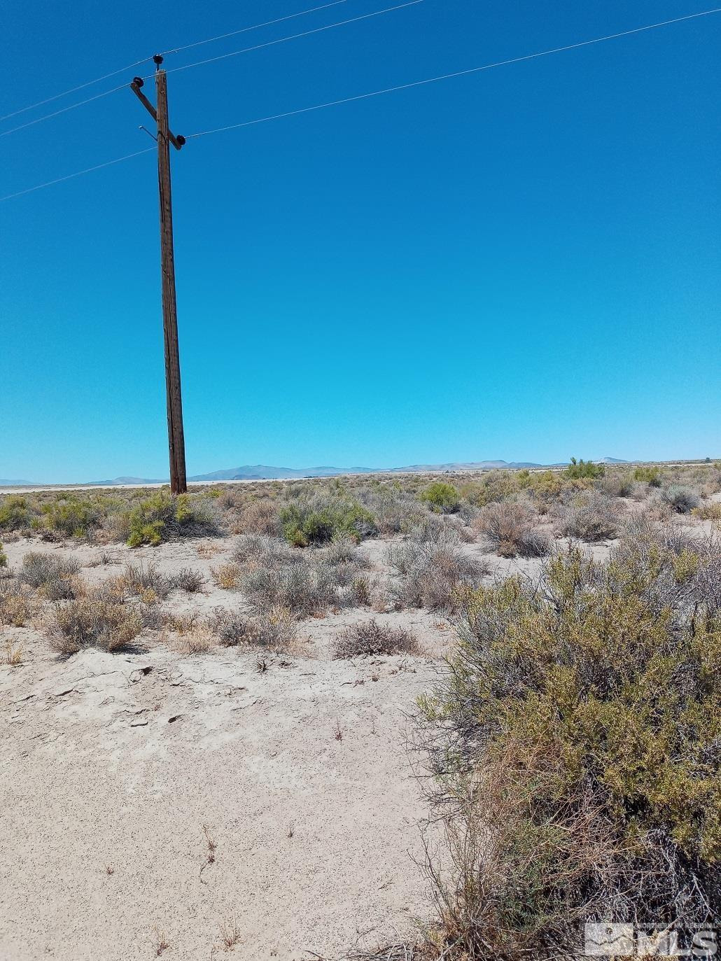 Apn # Apn Fallon, NV 89406 - Photo 1 of 6 a view of a dry yard with wooden fence