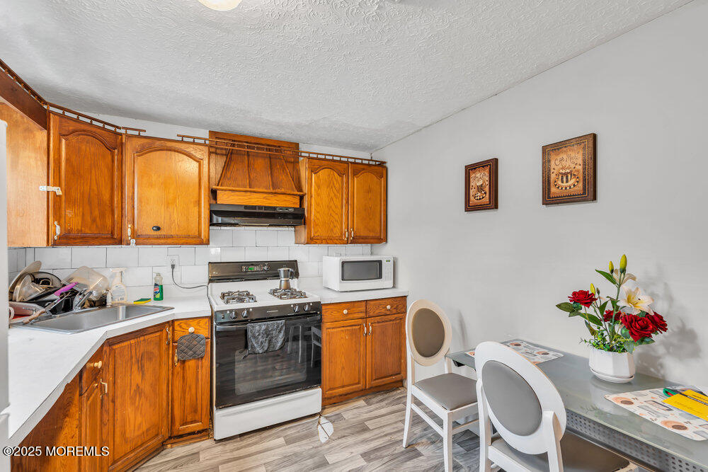 270 Alexander Avenue Howell, NJ 07731 - Photo 17 of 35 a kitchen with granite countertop breakfast area