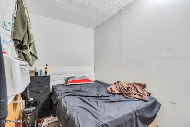 a bedroom with a bed and a closet