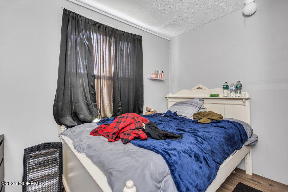 270 Alexander Avenue Howell, NJ 07731 - Photo 23 of 35 a bedroom with a bed and a dresser