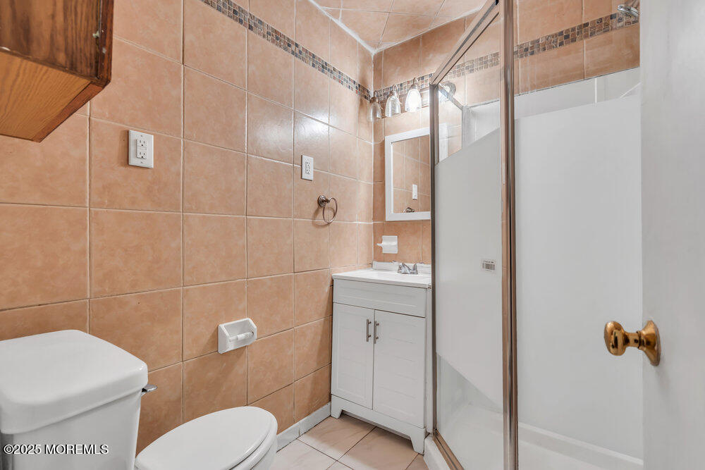 270 Alexander Avenue Howell, NJ 07731 - Photo 25 of 35 a bathroom with a toilet a sink and shower