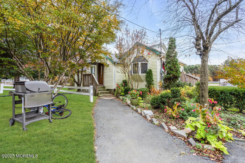 270 Alexander Avenue Howell, NJ 07731 - Photo 4 of 35 a front view of a house with a yard and sitting area