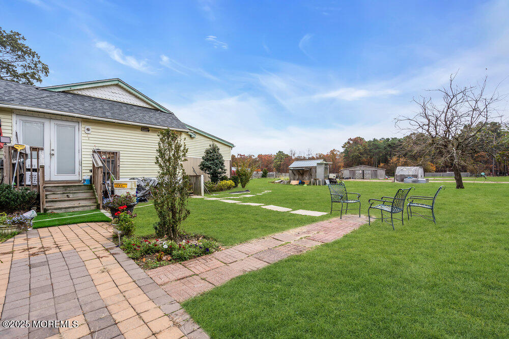270 Alexander Avenue Howell, NJ 07731 - Photo 6 of 35 a view of a house with backyard porch and garden