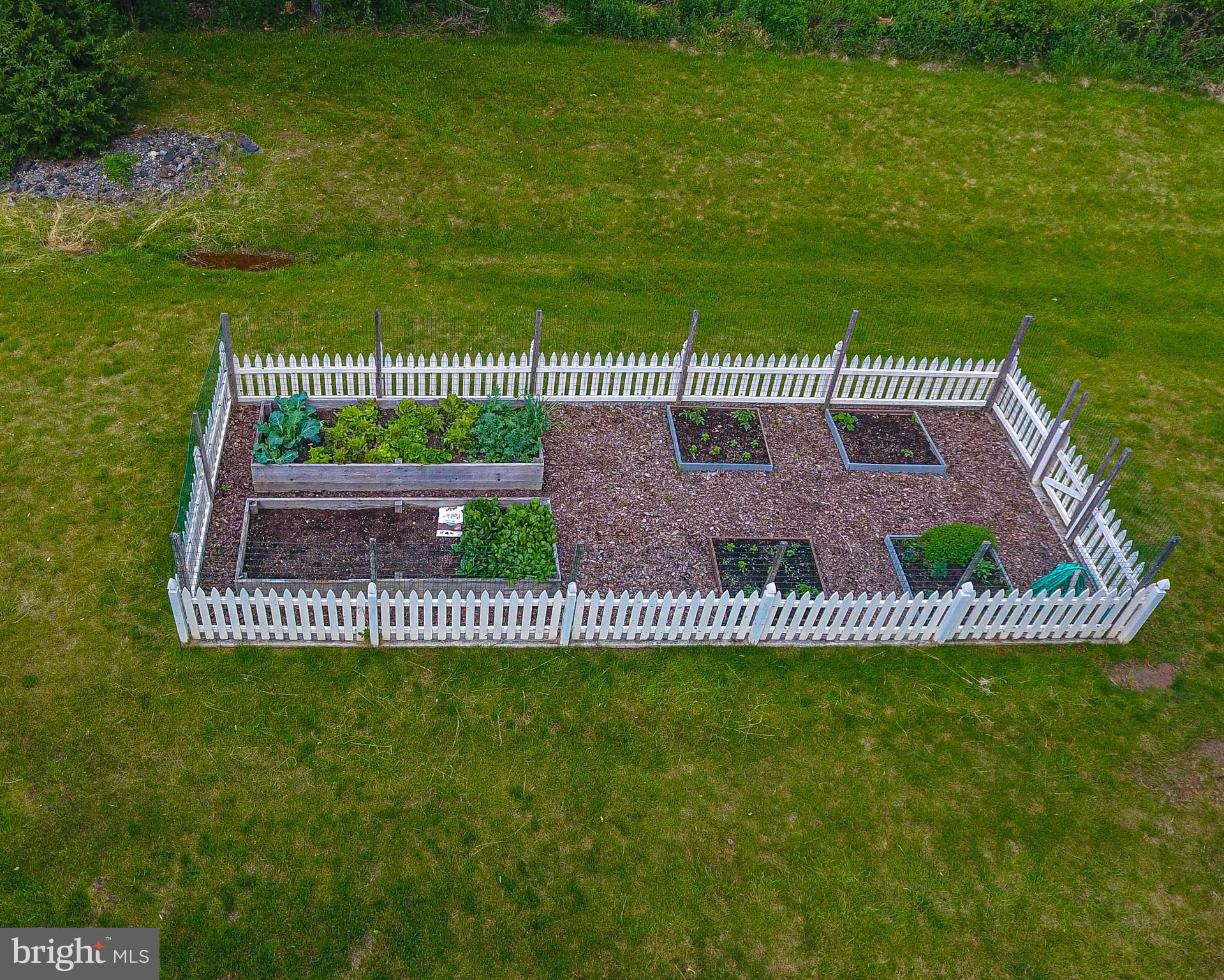 4040 Ruckman Way Doylestown, PA 18902 - Photo 39 of 48 Fenced vegetable garden with water tap for a hose