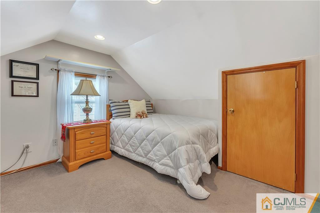 121 Highfield Road Colonia, NJ 07067 - Photo 14 of 23 a room with a bed and a dresser