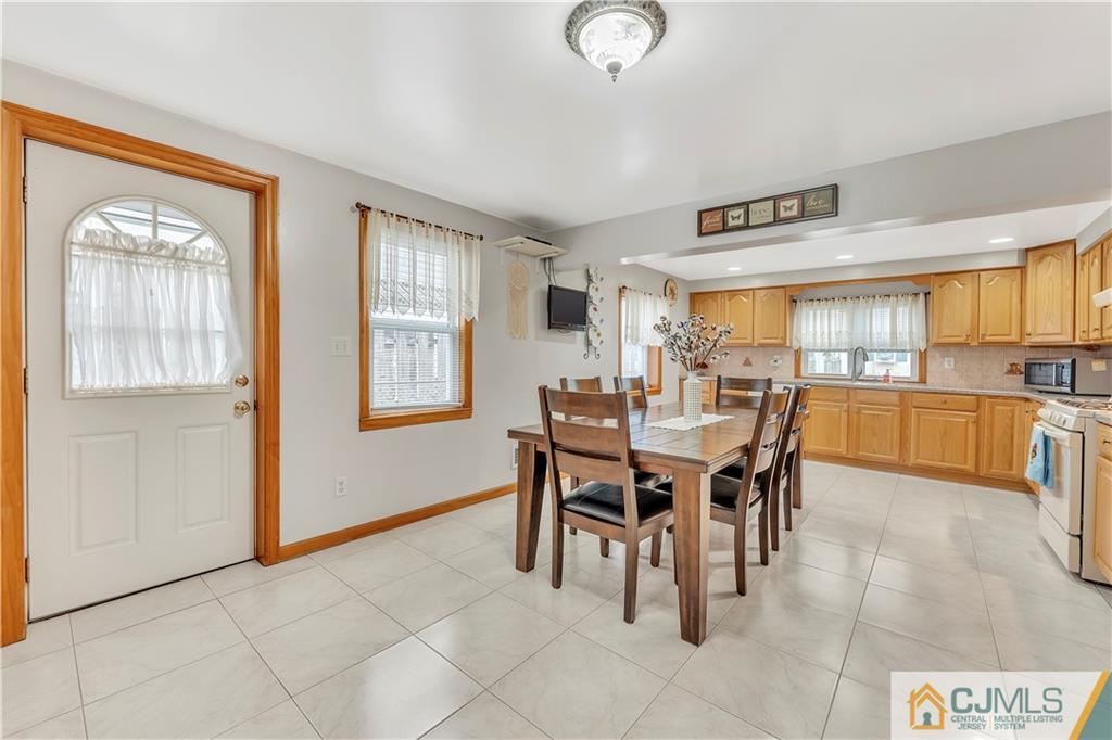 121 Highfield Road Colonia, NJ 07067 - Photo 9 of 23 a view of a dining room kitchen and a window