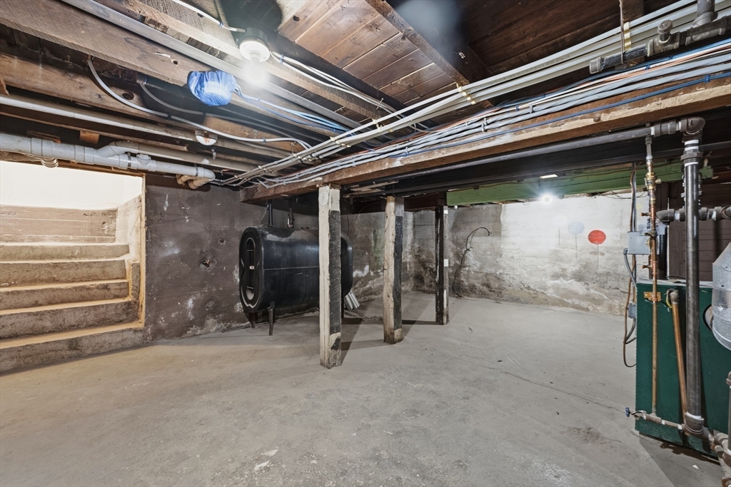 22 Douglas Avenue, Unit 1 Maynard, MA 01754 - Photo 19 of 19 a view of empty room with wooden walls