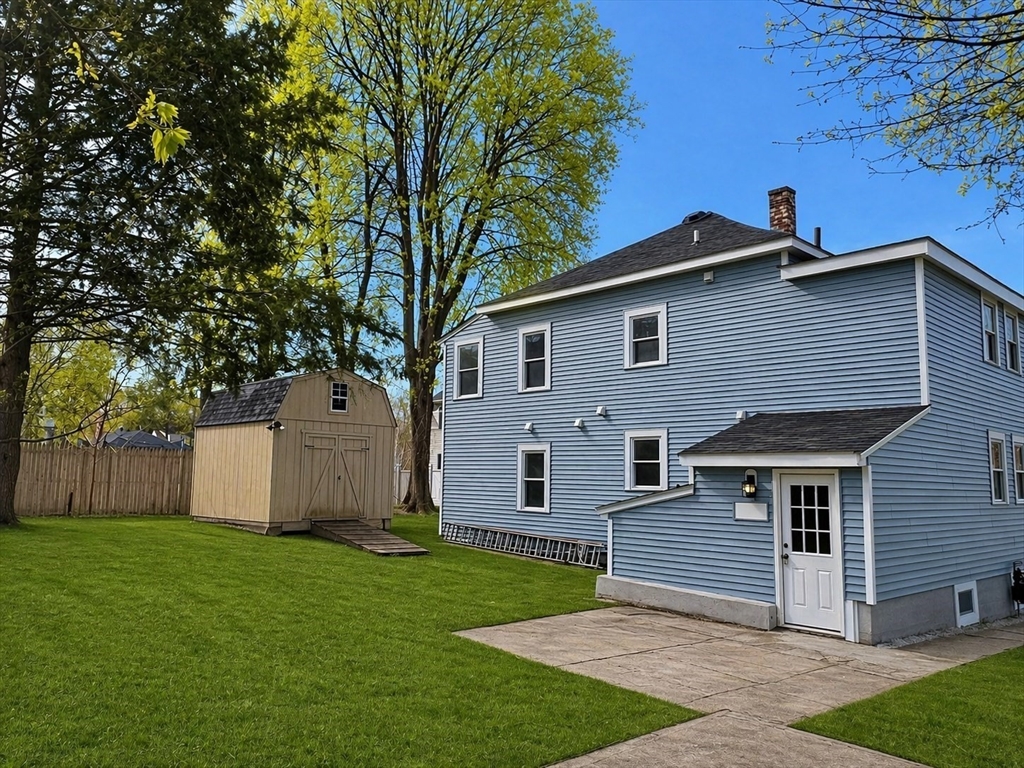 22 Douglas Avenue, Unit 1 Maynard, MA 01754 - Photo 4 of 19 a front view of house with a garden