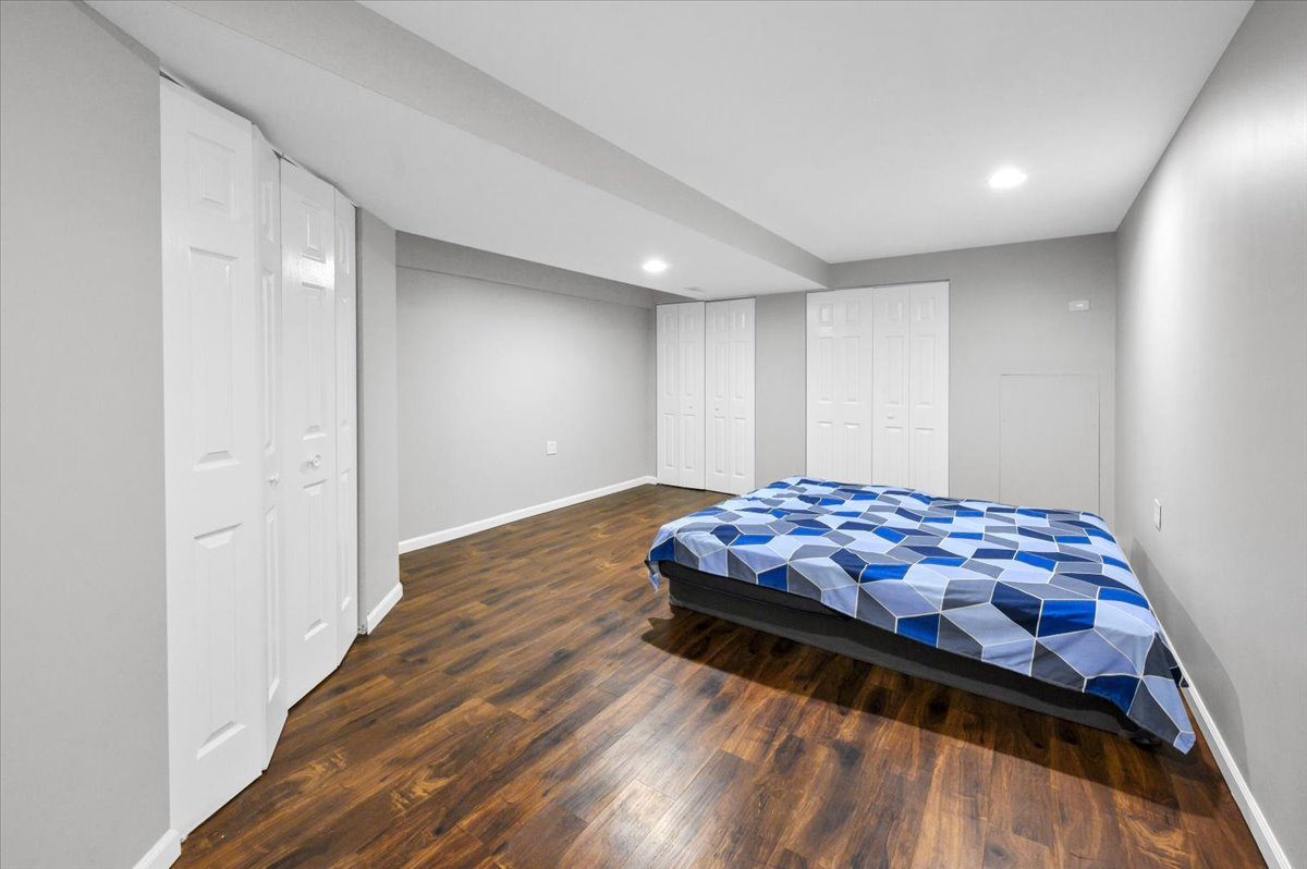 322 Zinnia Drive Romeoville, IL 60446 - Photo 24 of 42 a bedroom with wooden floor and window