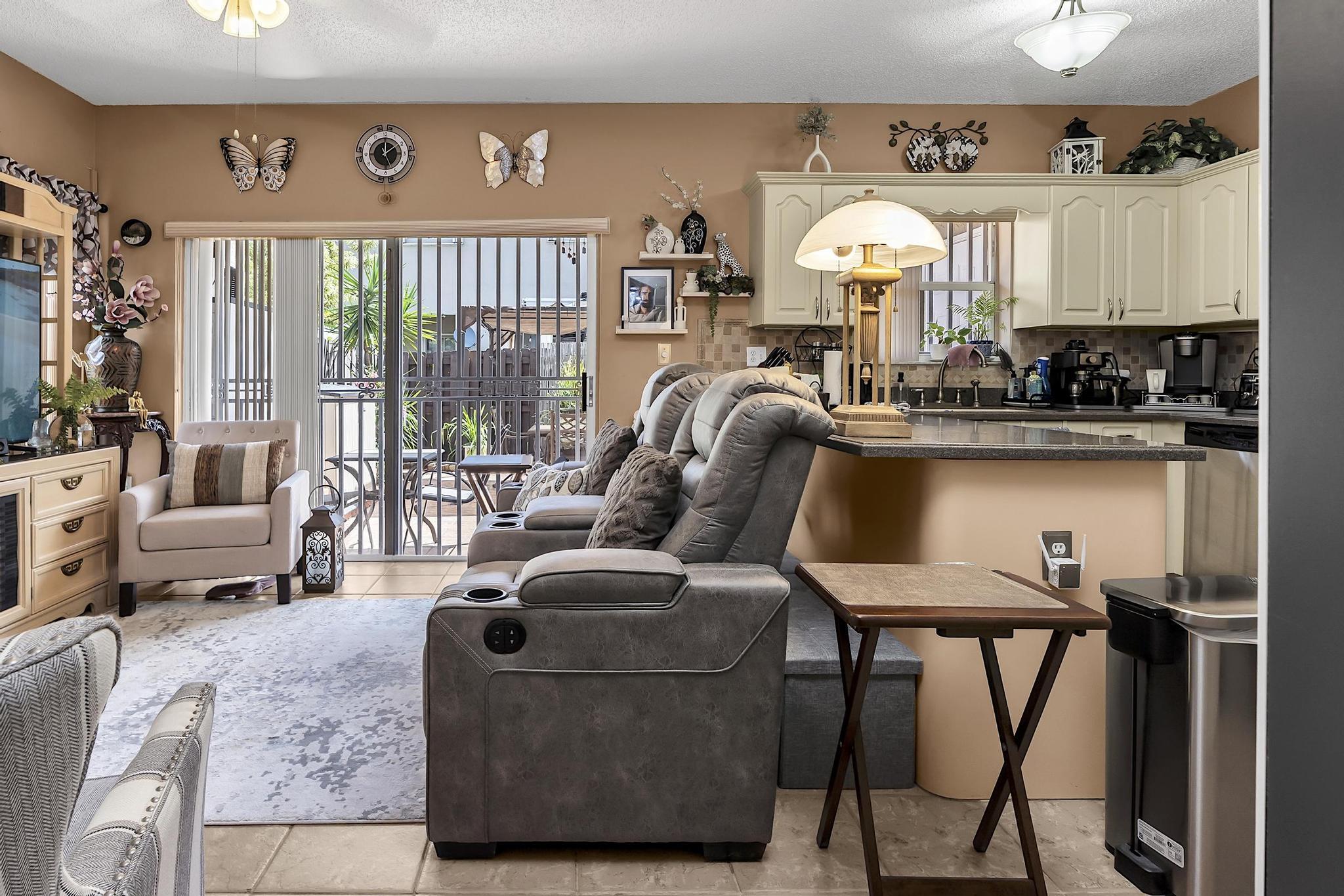 16637 Northwest 73rd Place Miami Lakes, FL 33014 - Photo 13 of 42 a living room with furniture and a large window