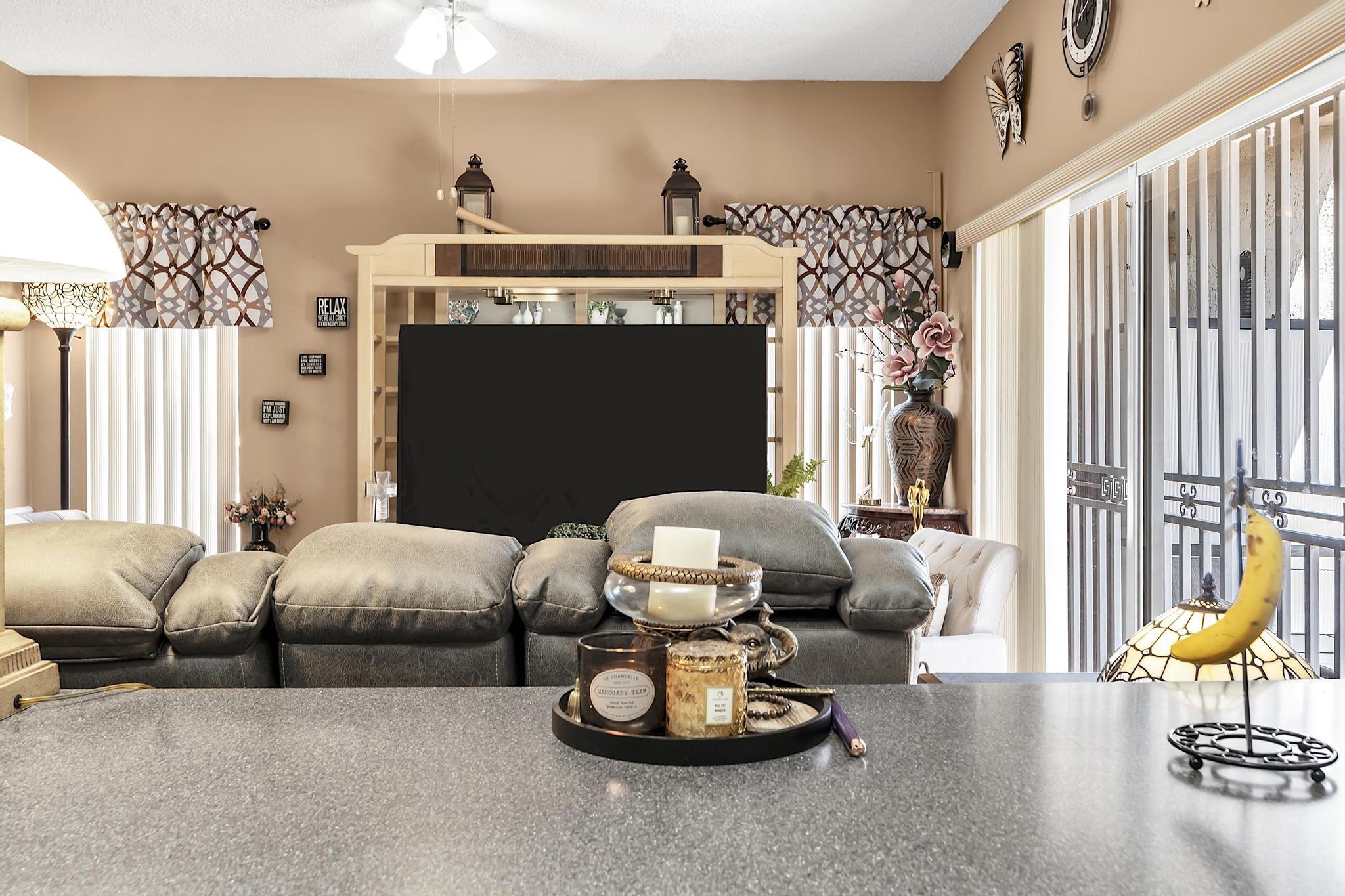 16637 Northwest 73rd Place Miami Lakes, FL 33014 - Photo 20 of 42 a living room with furniture and a fireplace