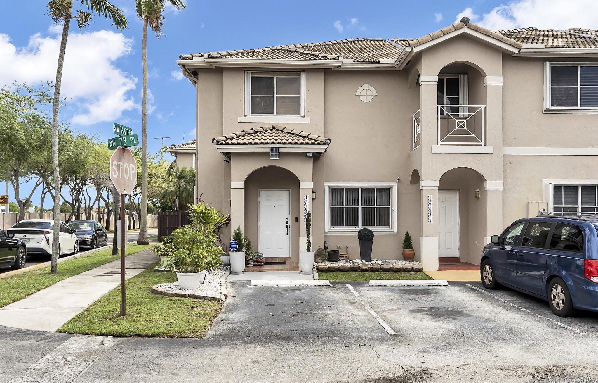 16637 Northwest 73rd Place Miami Lakes, FL 33014 - Photo 2 of 42 a house view with a outdoor space