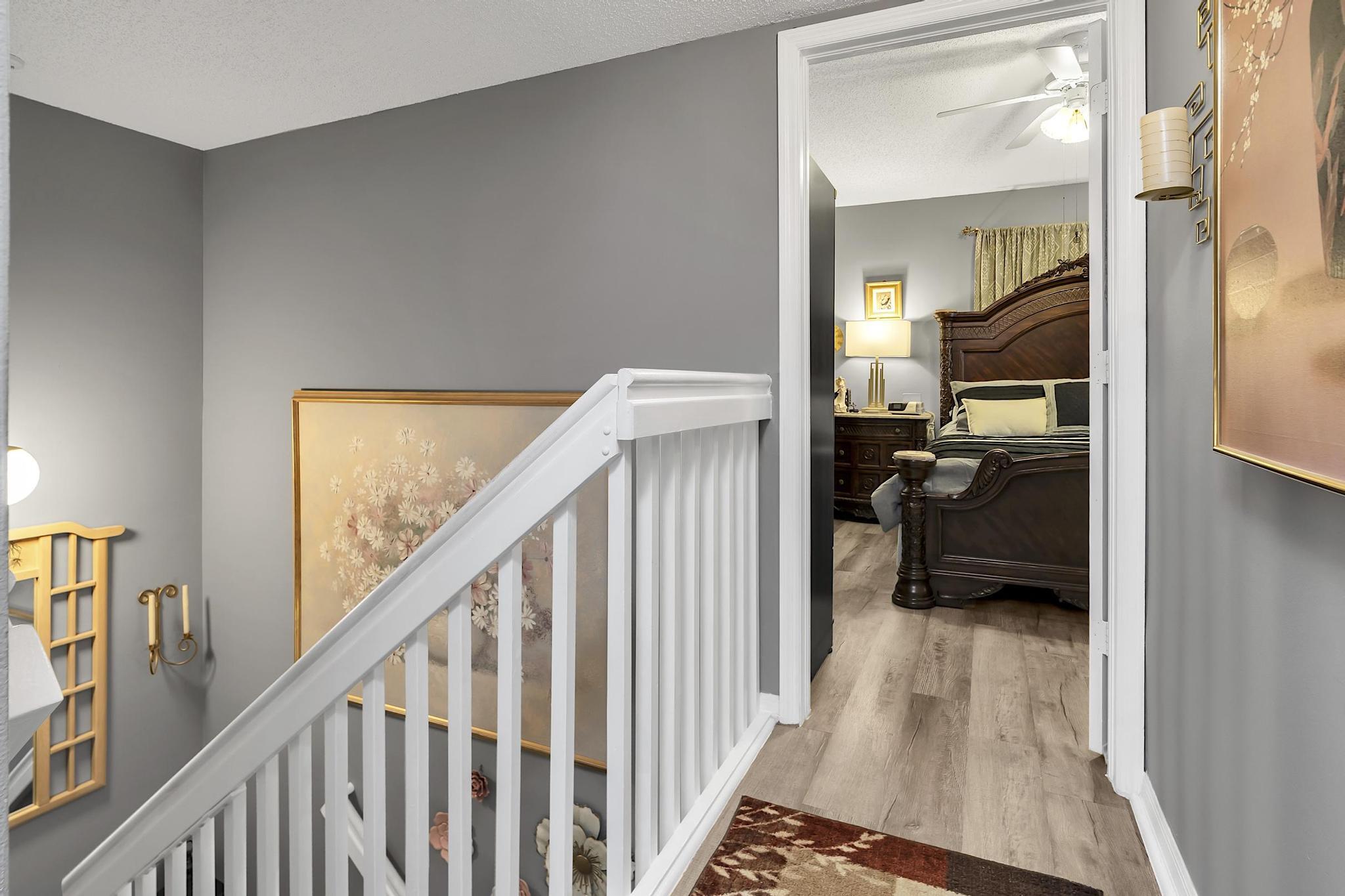 16637 Northwest 73rd Place Miami Lakes, FL 33014 - Photo 23 of 42 a view of a hallway and a livingroom with furniture