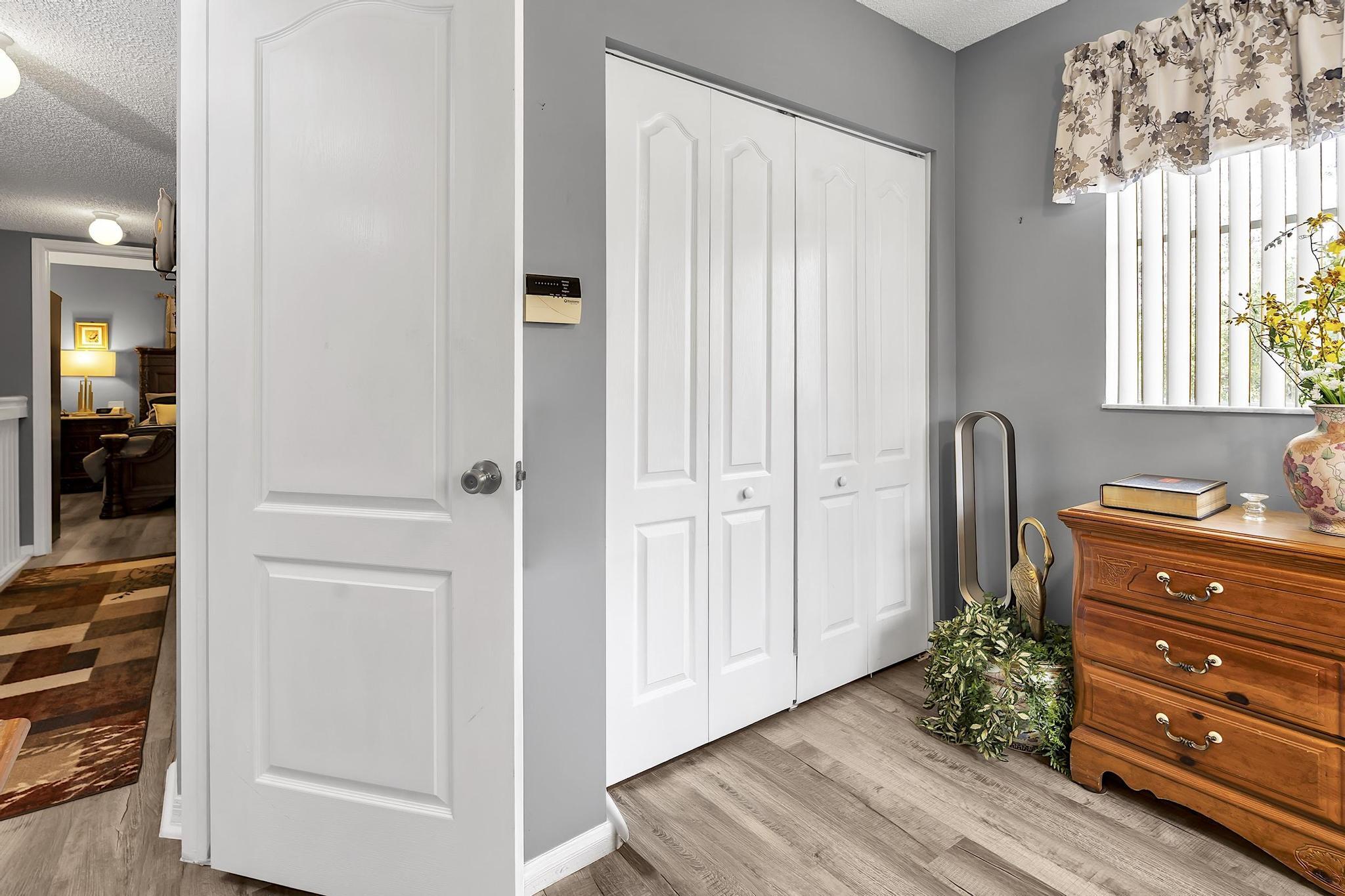 16637 Northwest 73rd Place Miami Lakes, FL 33014 - Photo 33 of 42 a view of a dresser with wooden floor and windows