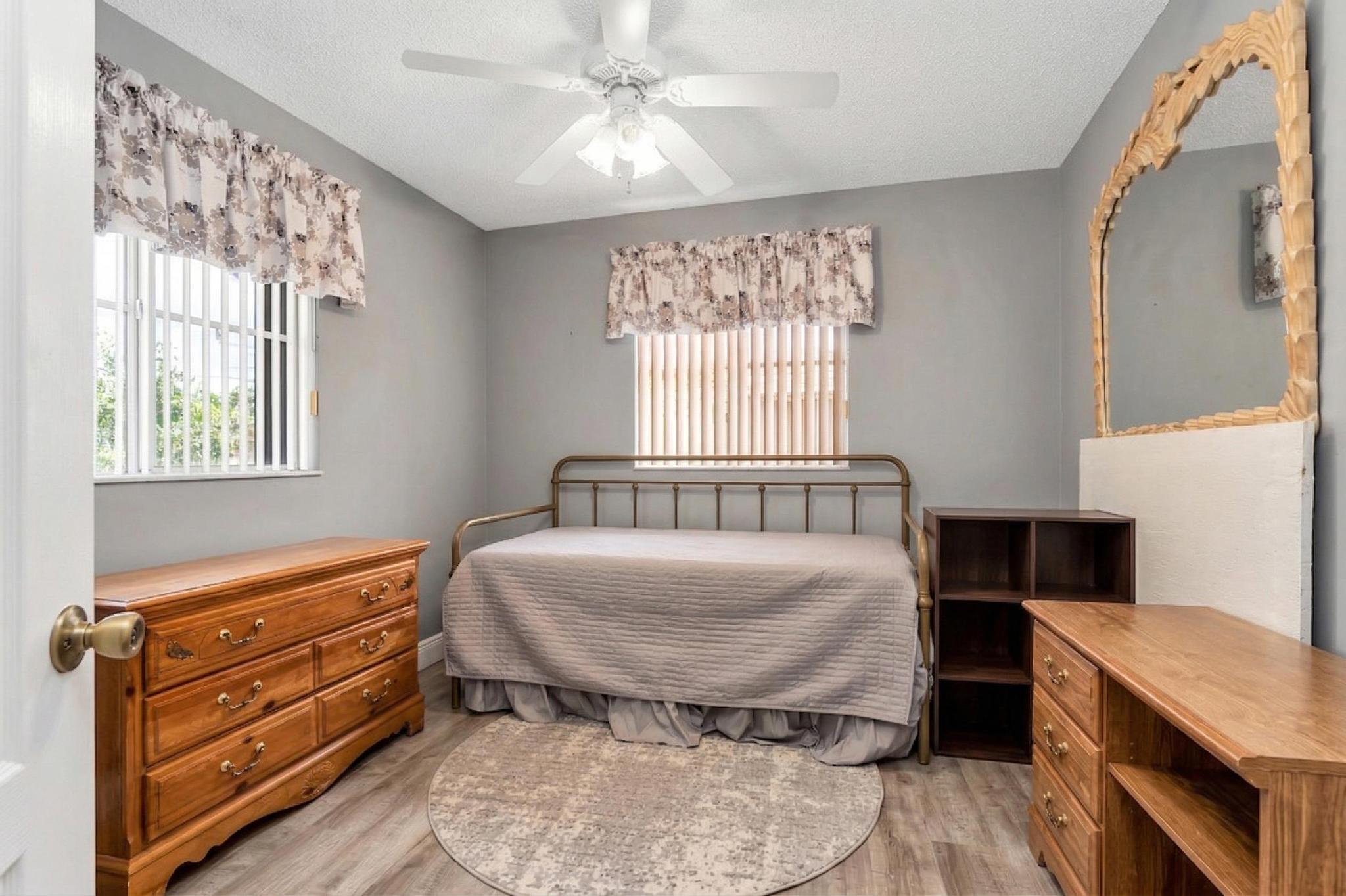 16637 Northwest 73rd Place Miami Lakes, FL 33014 - Photo 34 of 42 a room with a bed and a window