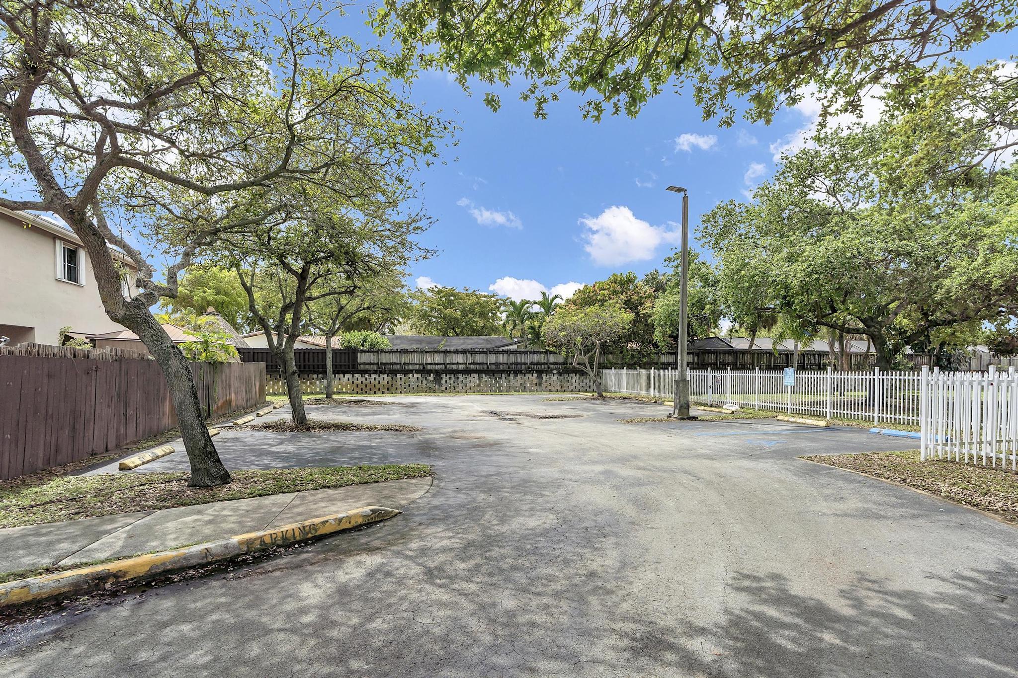 16637 Northwest 73rd Place Miami Lakes, FL 33014 - Photo 42 of 42 a view of a yard with wooden fence
