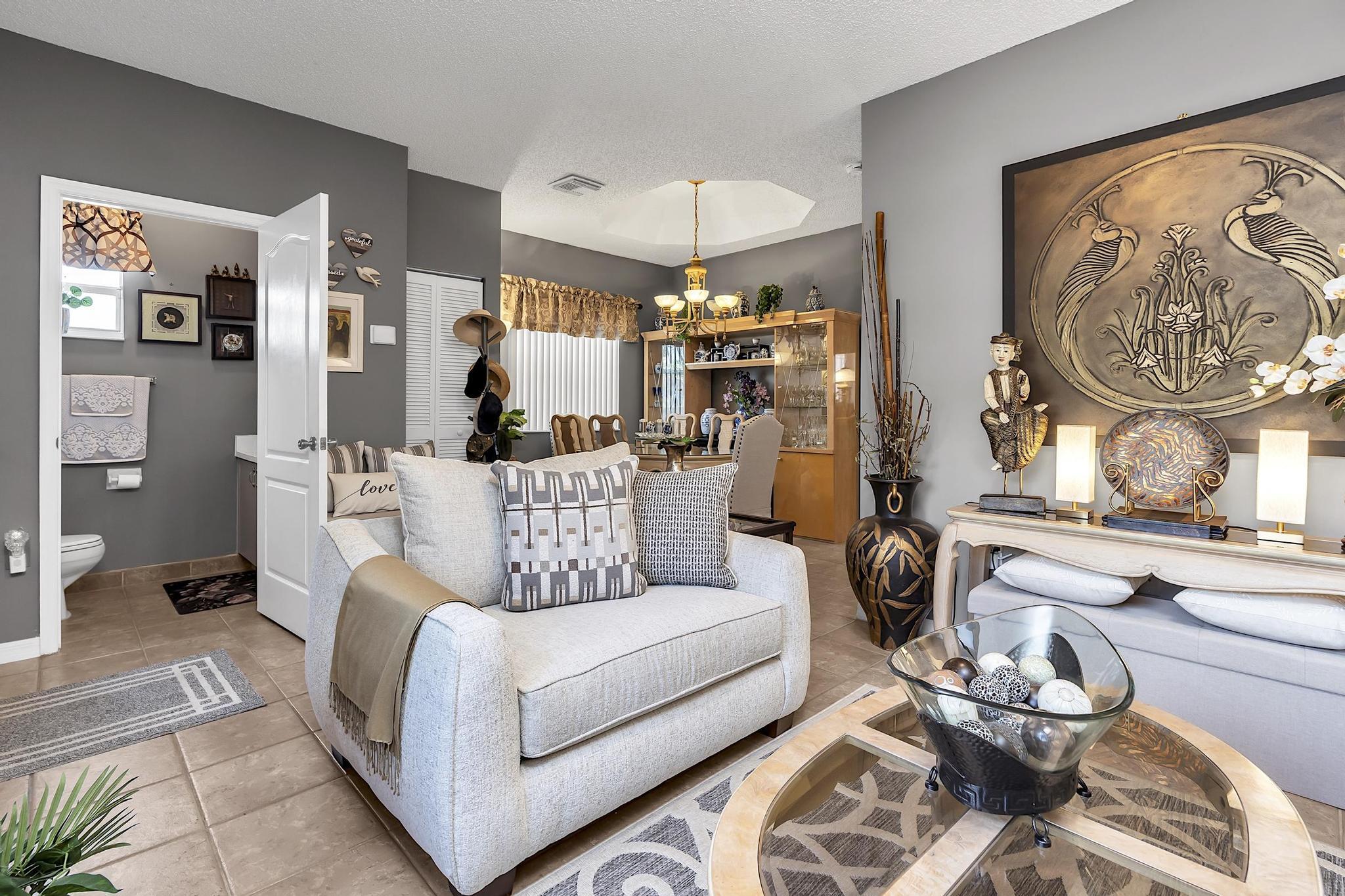 16637 Northwest 73rd Place Miami Lakes, FL 33014 - Photo 6 of 42 a living room with furniture and a large window