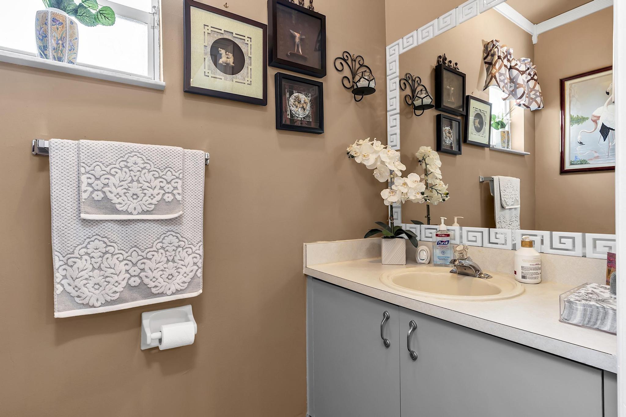 16637 Northwest 73rd Place Miami Lakes, FL 33014 - Photo 7 of 42 a bathroom with a sink and a mirror