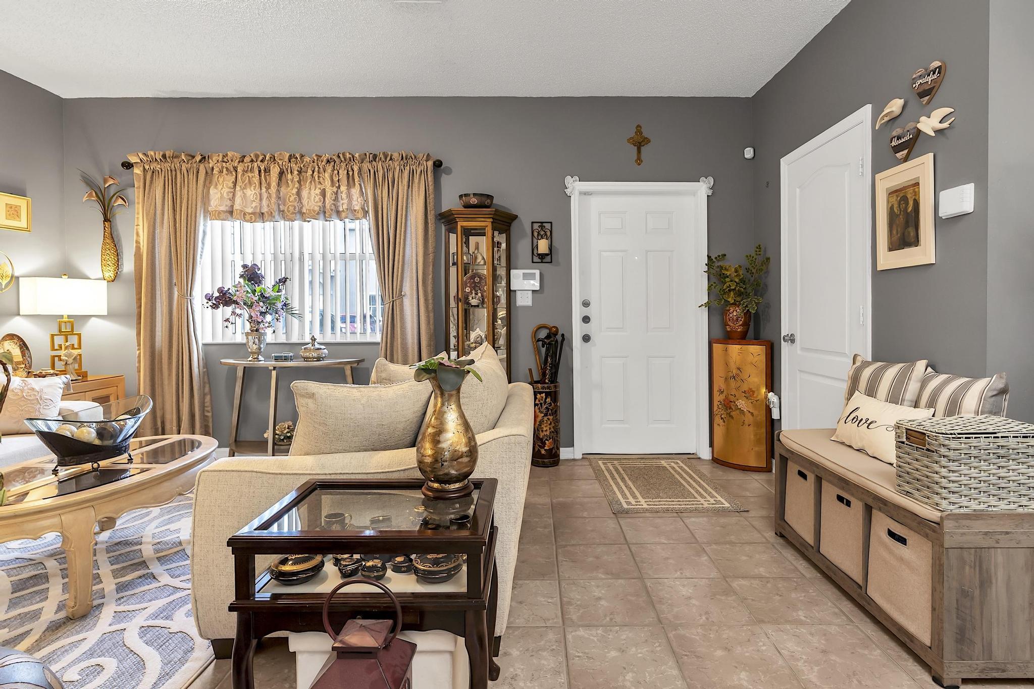 16637 Northwest 73rd Place Miami Lakes, FL 33014 - Photo 8 of 42 a living room with furniture and a large window