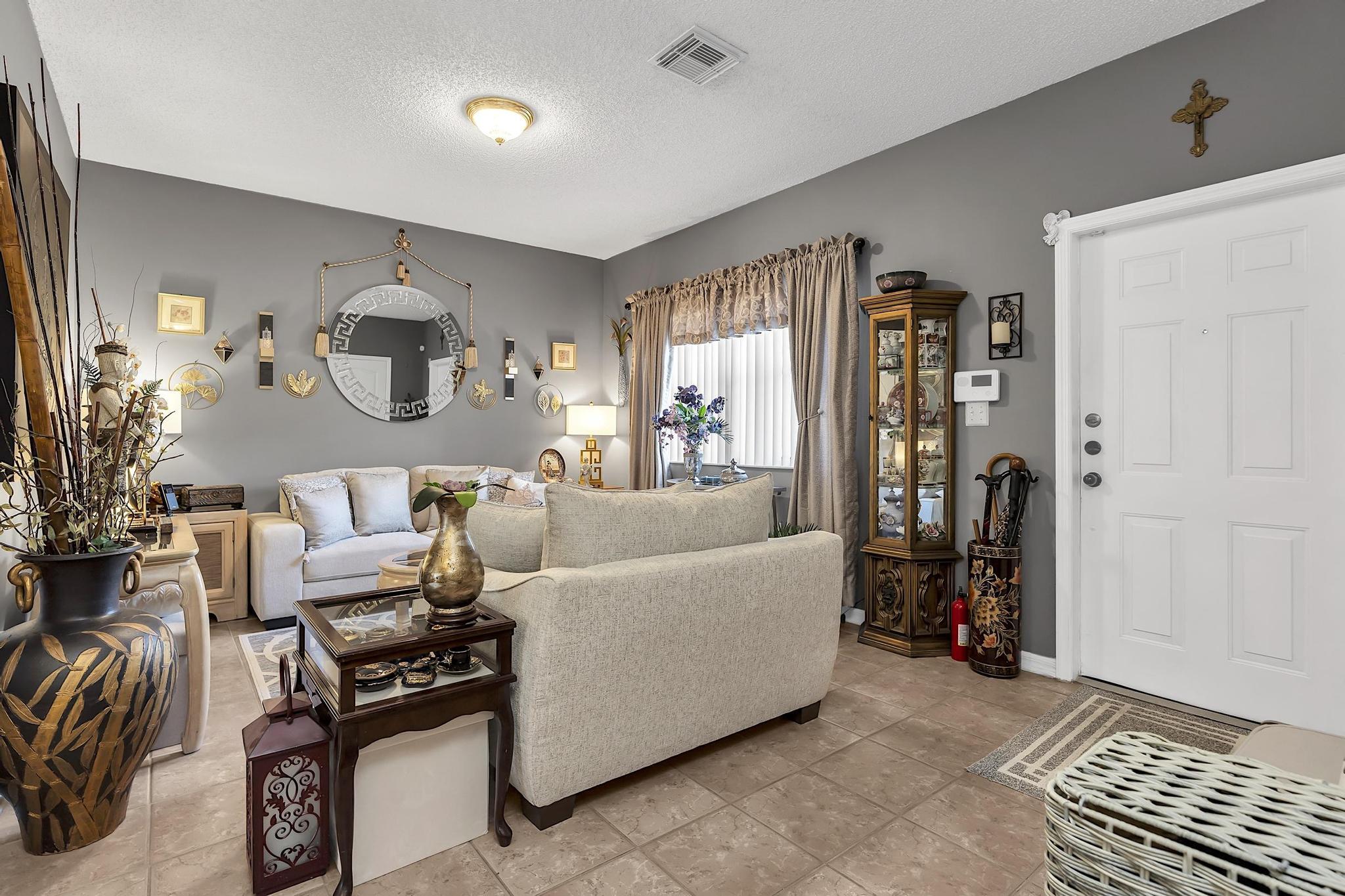 16637 Northwest 73rd Place Miami Lakes, FL 33014 - Photo 9 of 42 a living room with furniture and a window