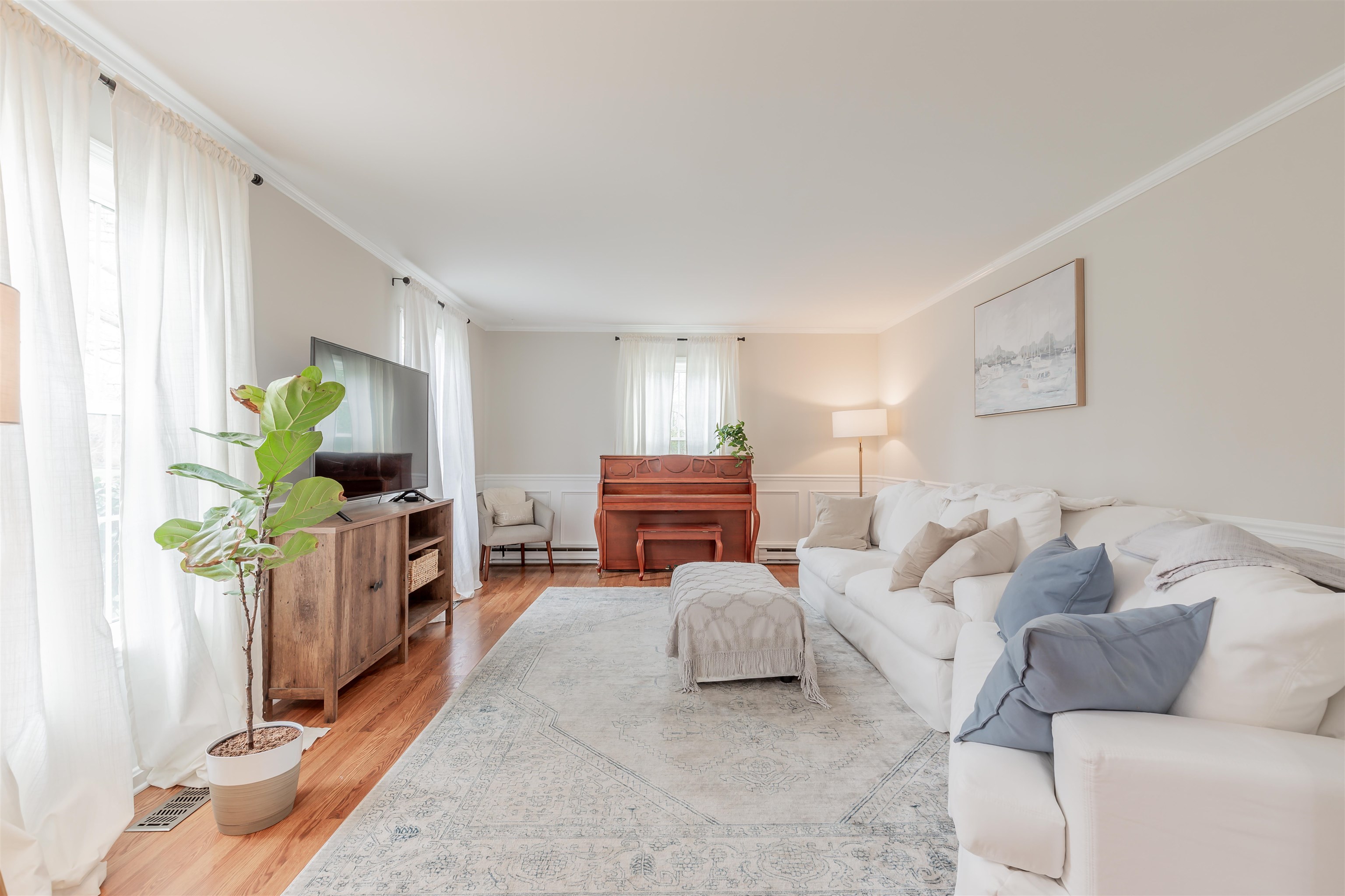 970 Tecumseh Road Erma, NJ 08204 - Photo 3 of 50 a living room with furniture a window and a flat screen tv
