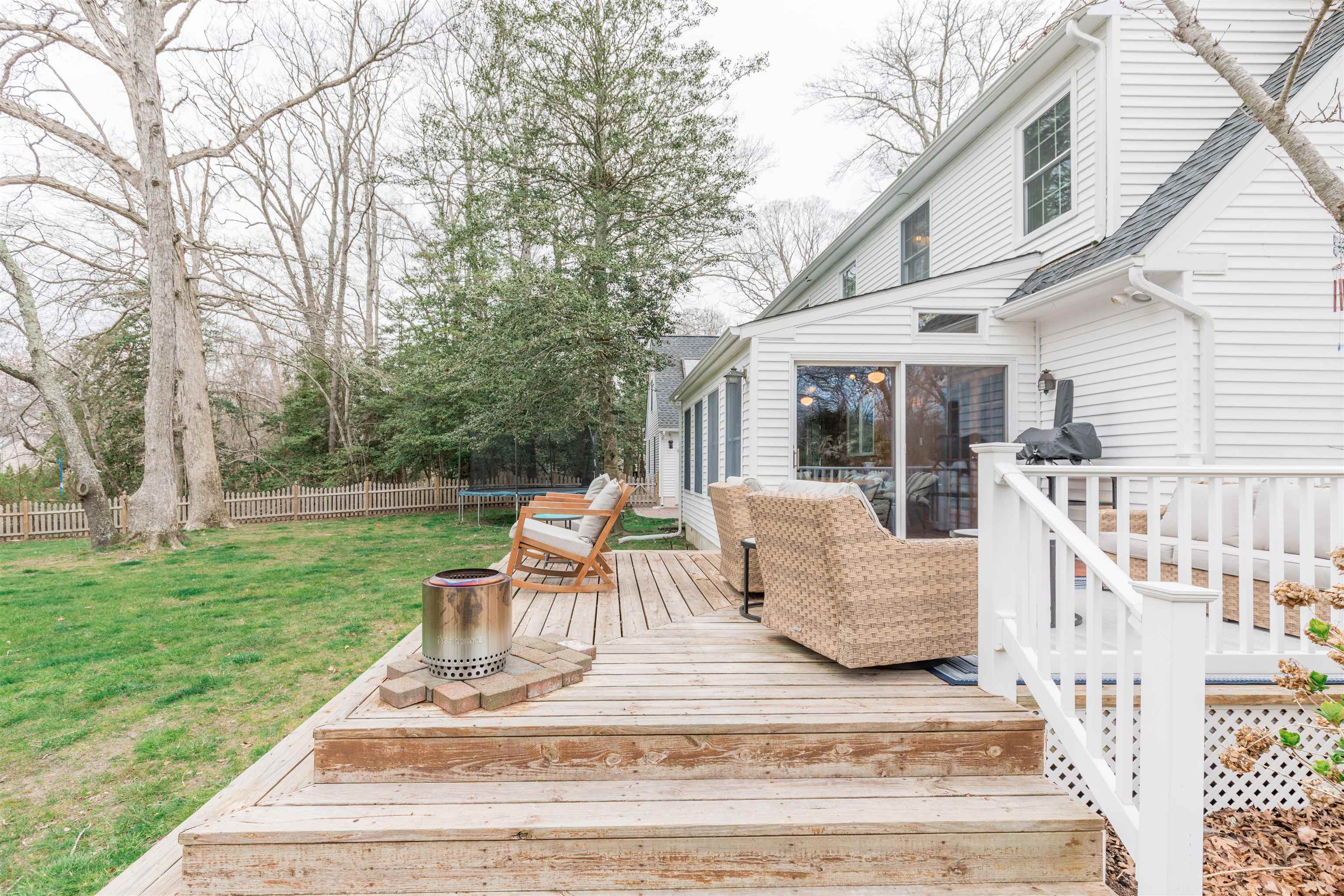 970 Tecumseh Road Erma, NJ 08204 - Photo 40 of 50 a view of a patio with couches chairs and large trees