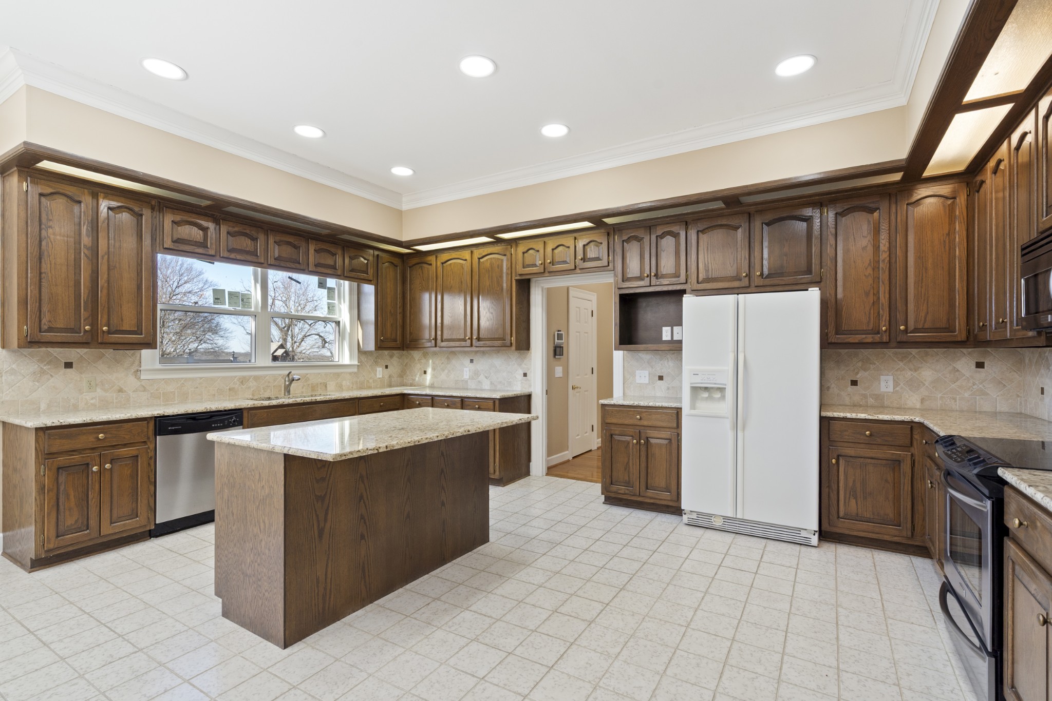 201 Vineyard Way Lebanon, TN 37087 - Photo 14 of 58 a kitchen with stainless steel appliances granite countertop a refrigerator and a sink