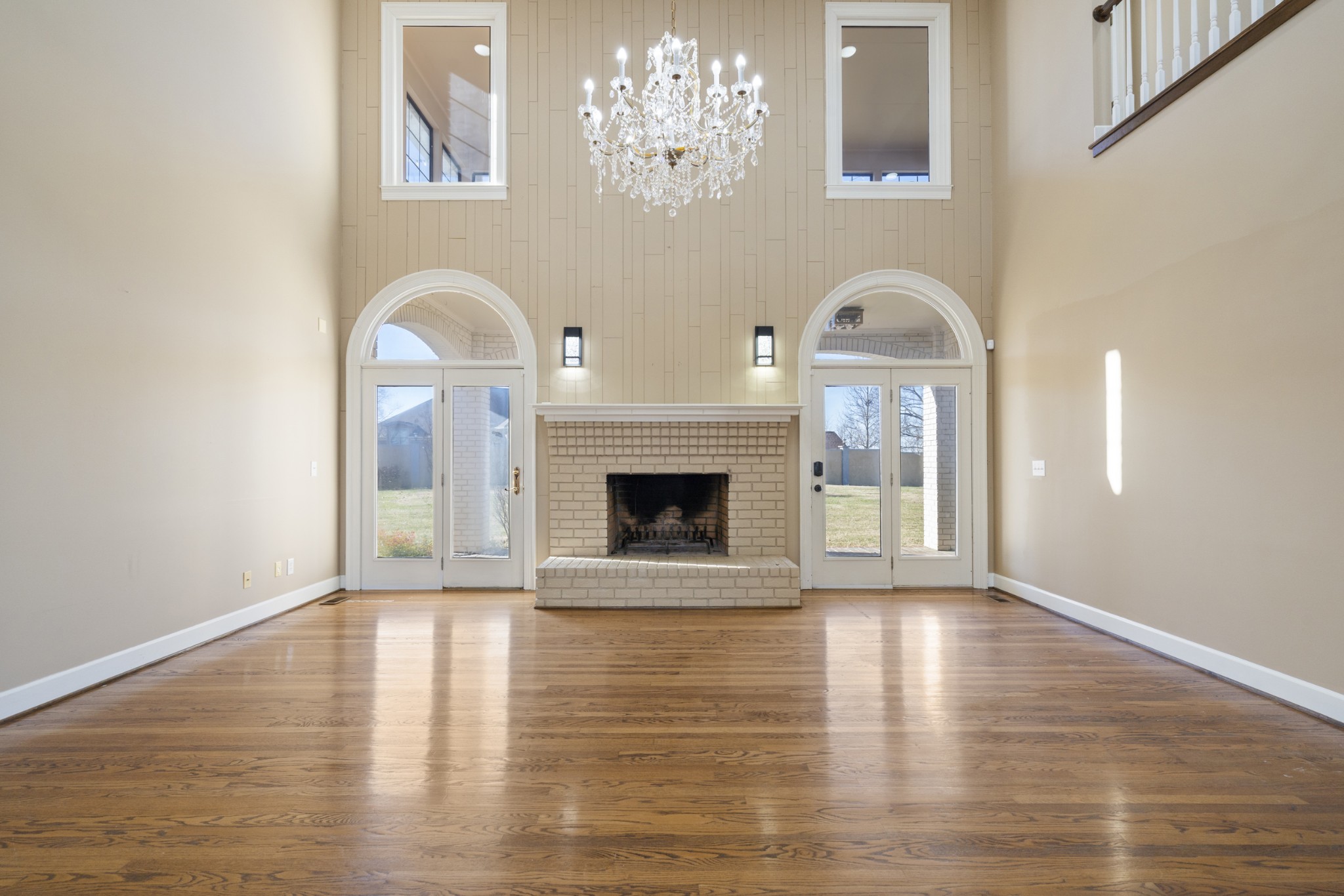 201 Vineyard Way Lebanon, TN 37087 - Photo 16 of 58 a view of an empty room with a fireplace and a chandelier