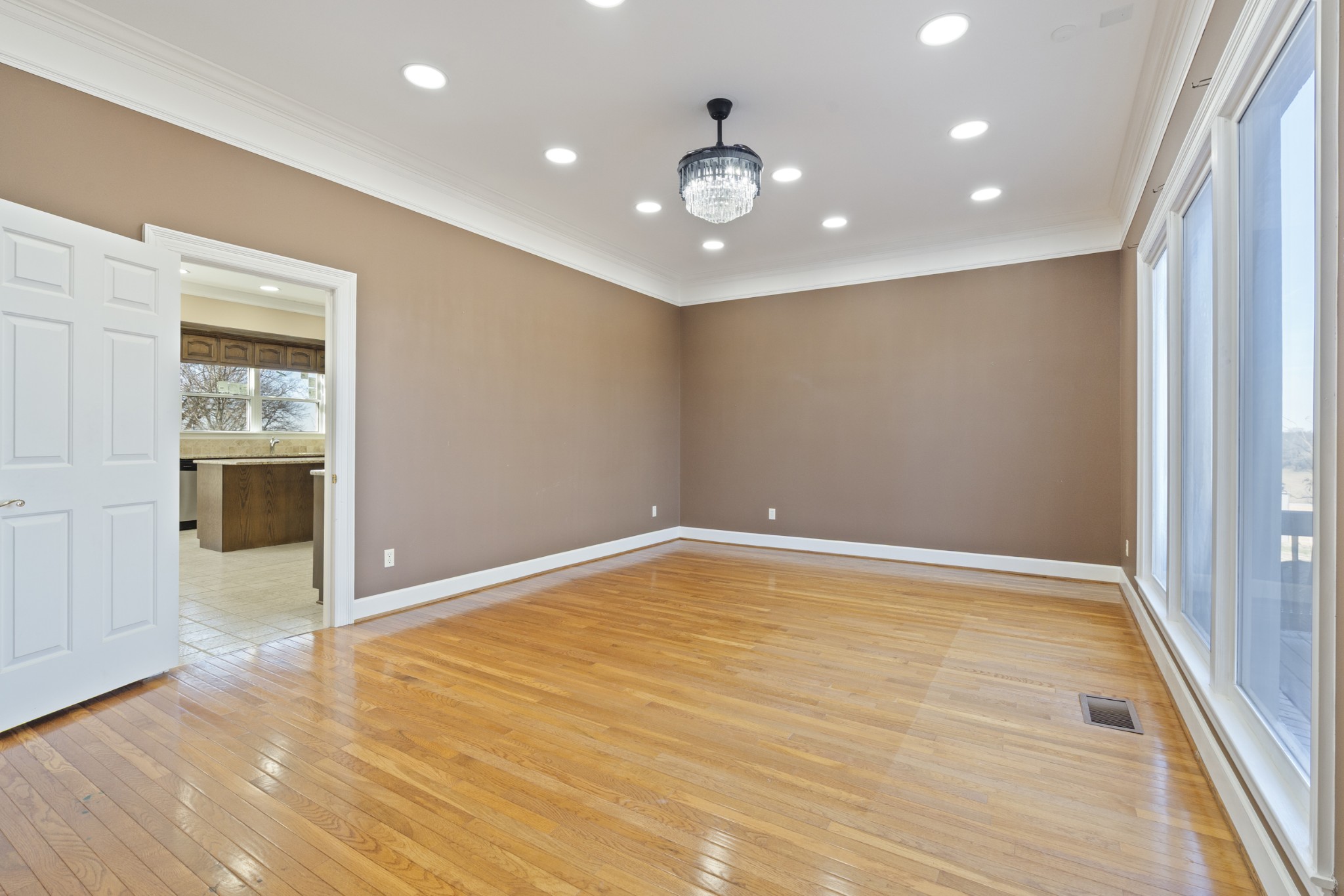 201 Vineyard Way Lebanon, TN 37087 - Photo 19 of 58 an empty room with wooden floor and windows