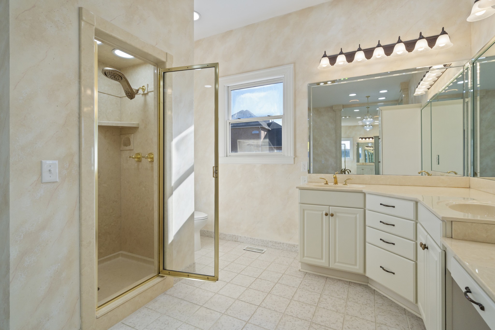 201 Vineyard Way Lebanon, TN 37087 - Photo 27 of 58 a spacious bathroom with a shower sink and mirror