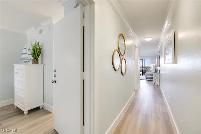 a bedroom with a bed and a night stand