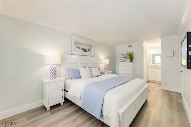 a white toilet sitting next to a bath tub