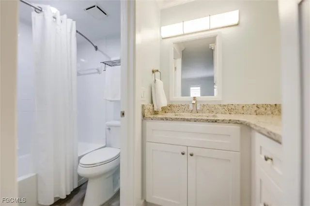 a bathroom with a shower and a toilet