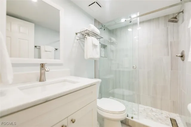 a view of a dining room with furniture wooden floor and a chandelier