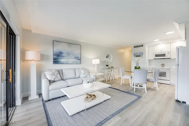 a view of a balcony with table and chairs