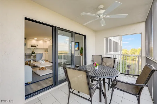 a view of a balcony dining area with a table