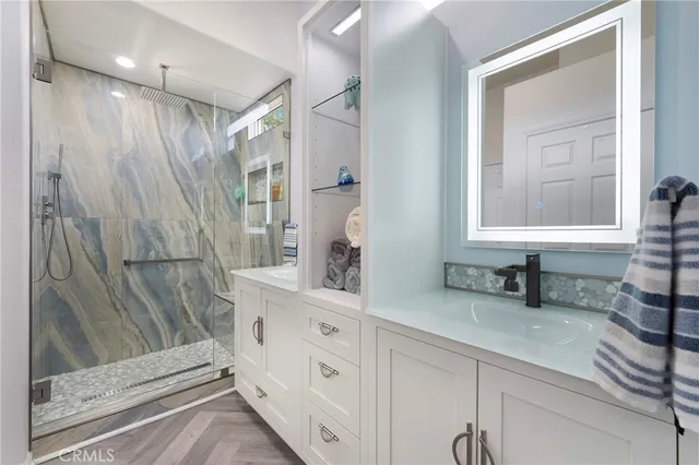 a bathroom with a double vanity sink and a mirror