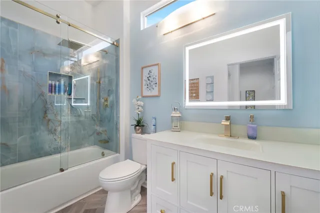 a bathroom with a sink a toilet and a bathtub