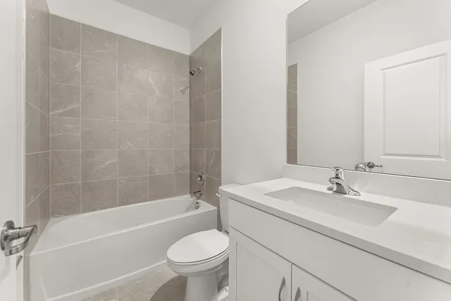 a bathroom with a sink toilet and bathtub