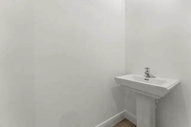 a bathroom with a sink and mirror