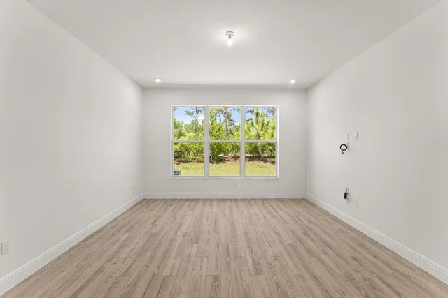 a view of room with window and hardwood