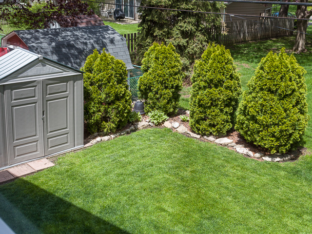 21W230 Coronet Road Lombard, IL 60148 - Photo 23 of 24 a view of a backyard with plants