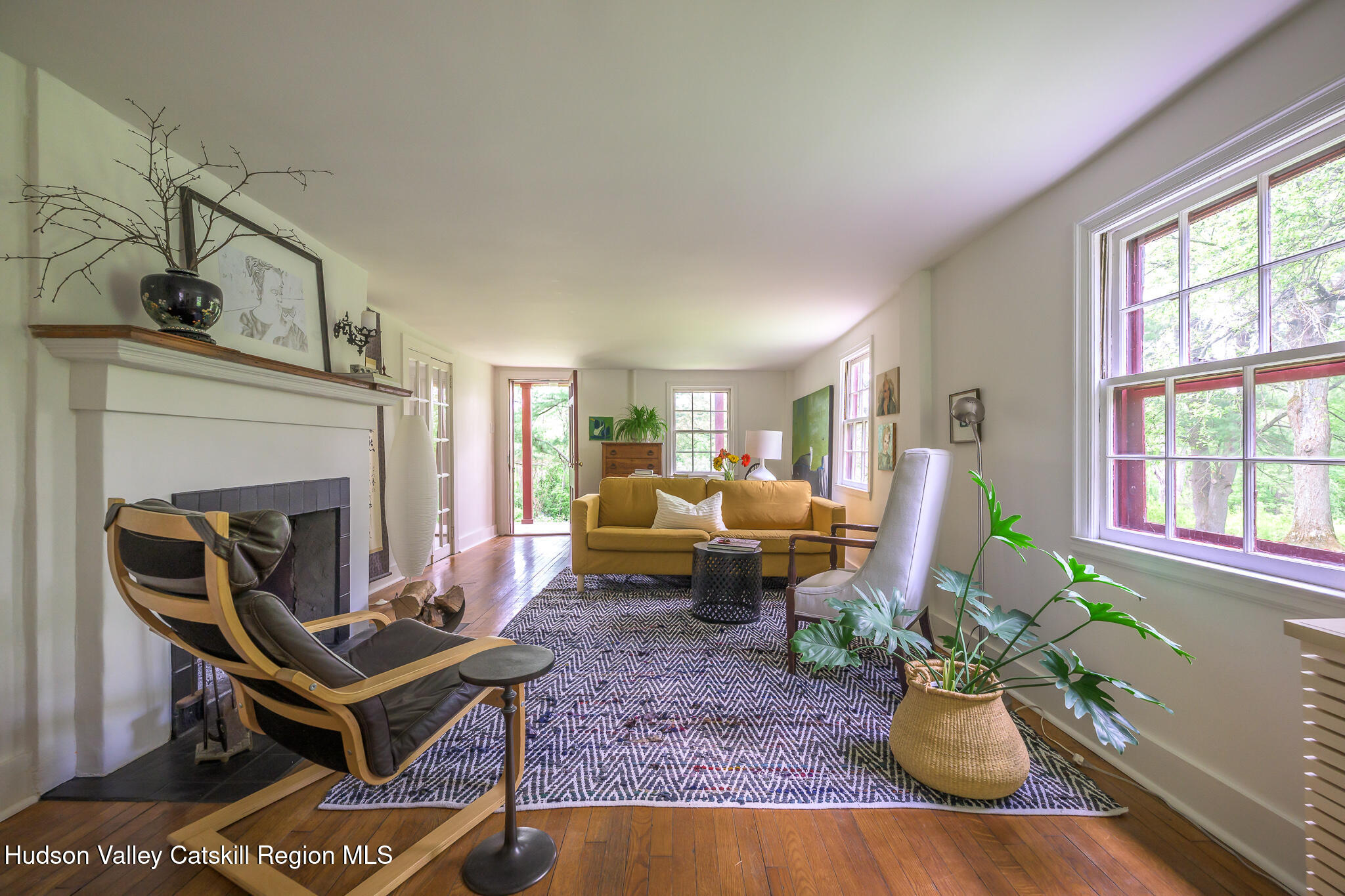 1963 County Rte 5 Canaan, NY 12029 - Photo 20 of 46 a living room with furniture or couch and a fireplace
