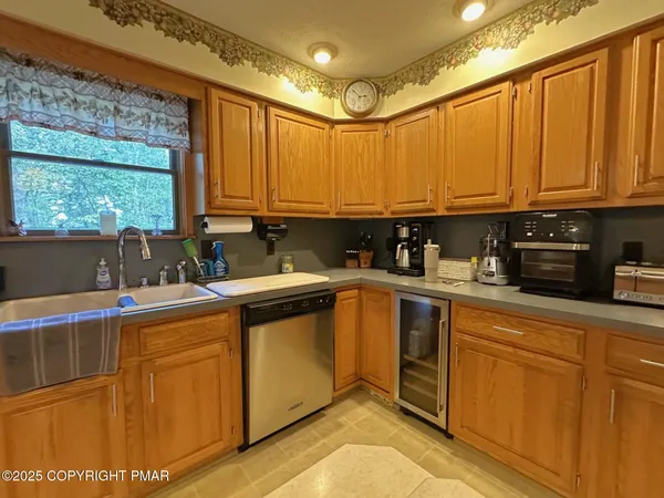 a kitchen with stainless steel appliances a refrigerator and a sink