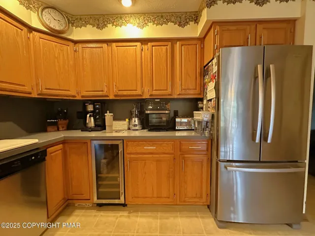 a spacious bedroom with a bed and a chandelier