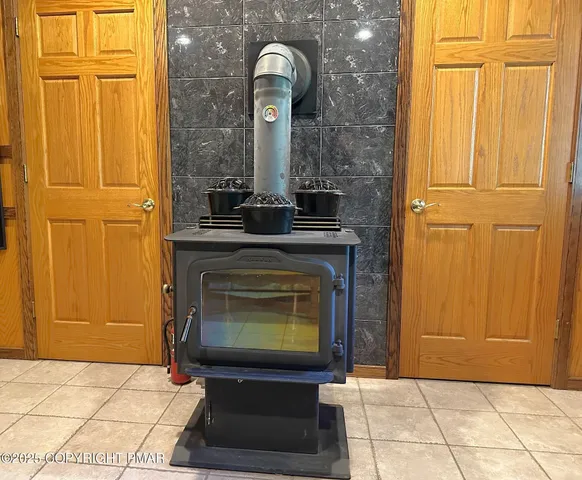 a bedroom with a bed a window and closet